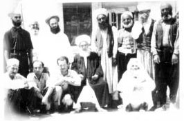 Shaykh Abdullah ad-Dagehestaniwith murids in Damascus.  Shaykh Nazim is to the right of Grandshaykh and  Shaykh Hussein is to his left.